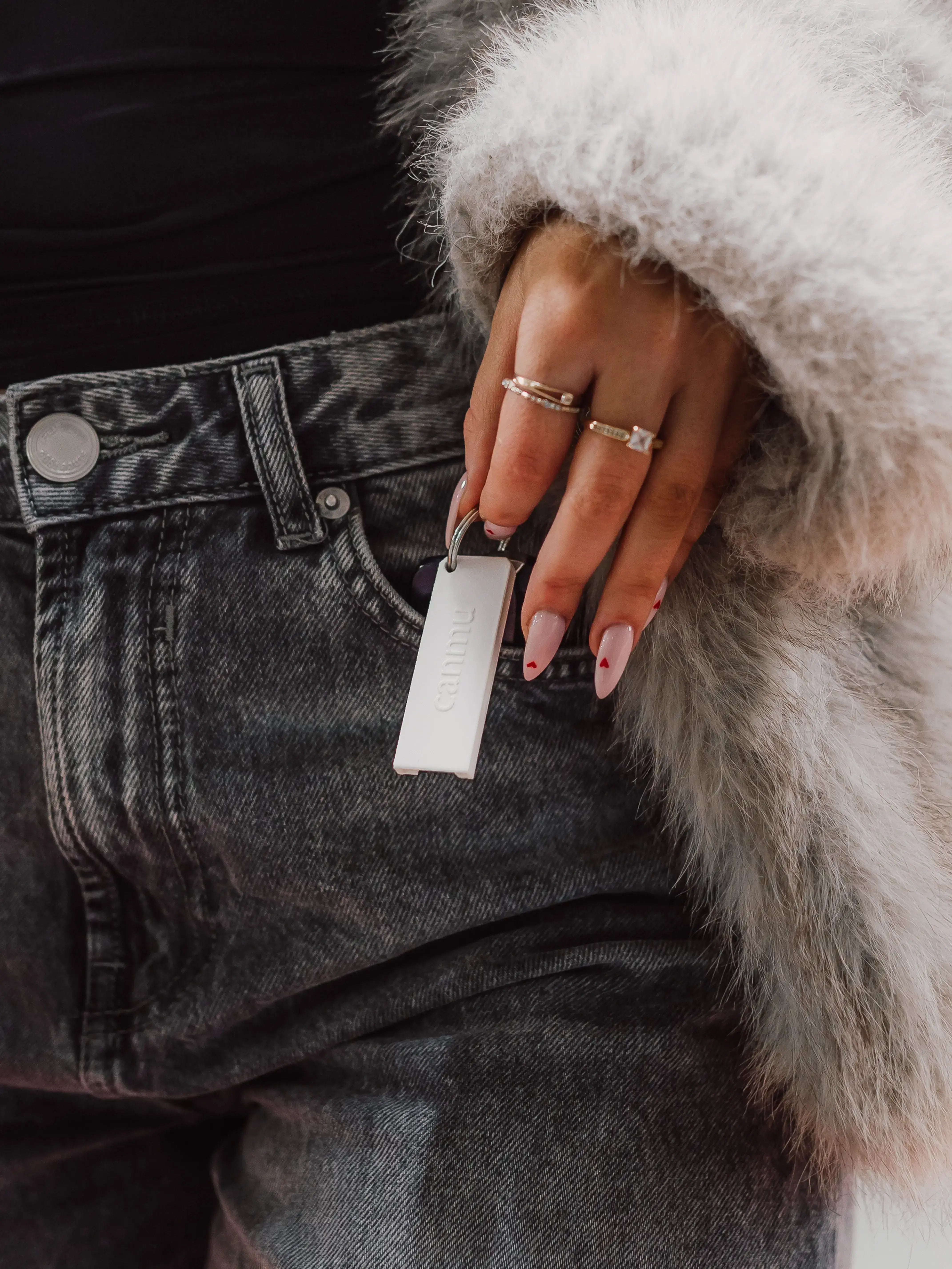 white canmu product held with long nails